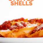 Side photo of a plate of vegan stuffed shells with the words vegan stuffed shells