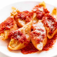 Square photo of a plate of vegan stuffed shells