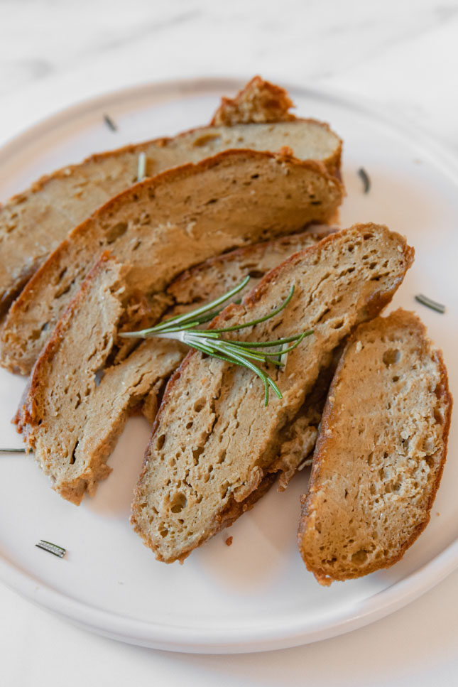 Close-up shot of some slices of vegan turkey on a plate