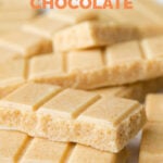 Close-up photo of some vegan white chocolate with the words vegan white chocolate