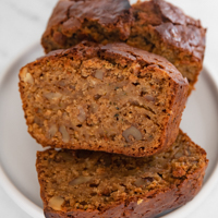 Square photo of some slices of vegan zucchini bread