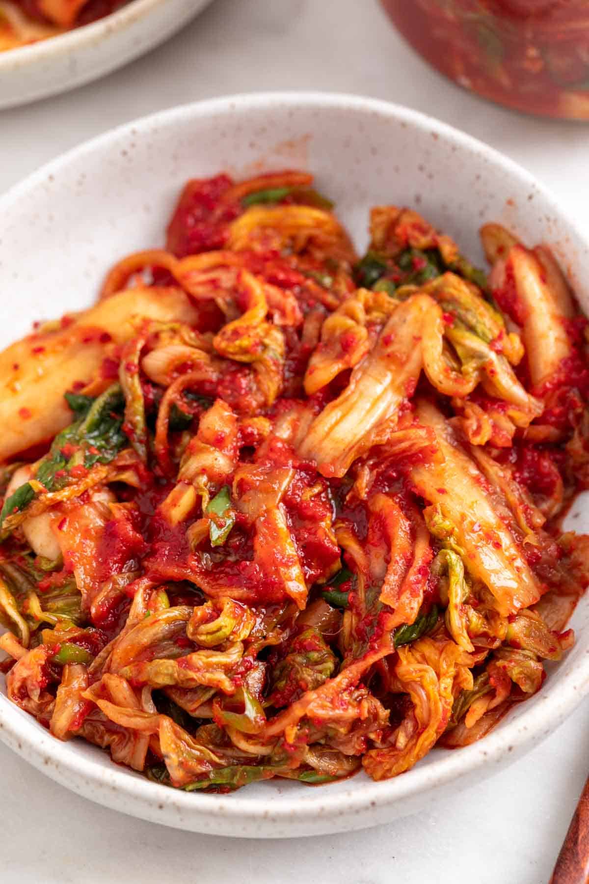 Homemade vegan kimchi in a shallow dish.